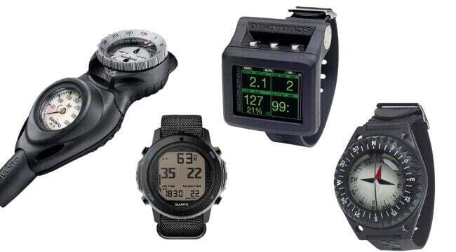 Collection of scuba diving instruments including dive computers, pressure gauges and underwater navigation compass.